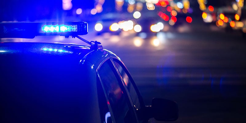 bigstock-Police-Car-Lights-At-Night-In--276413461-web