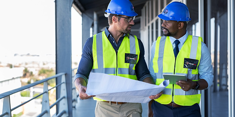 A Security 101 sales engineer performs a site walk and review with a client