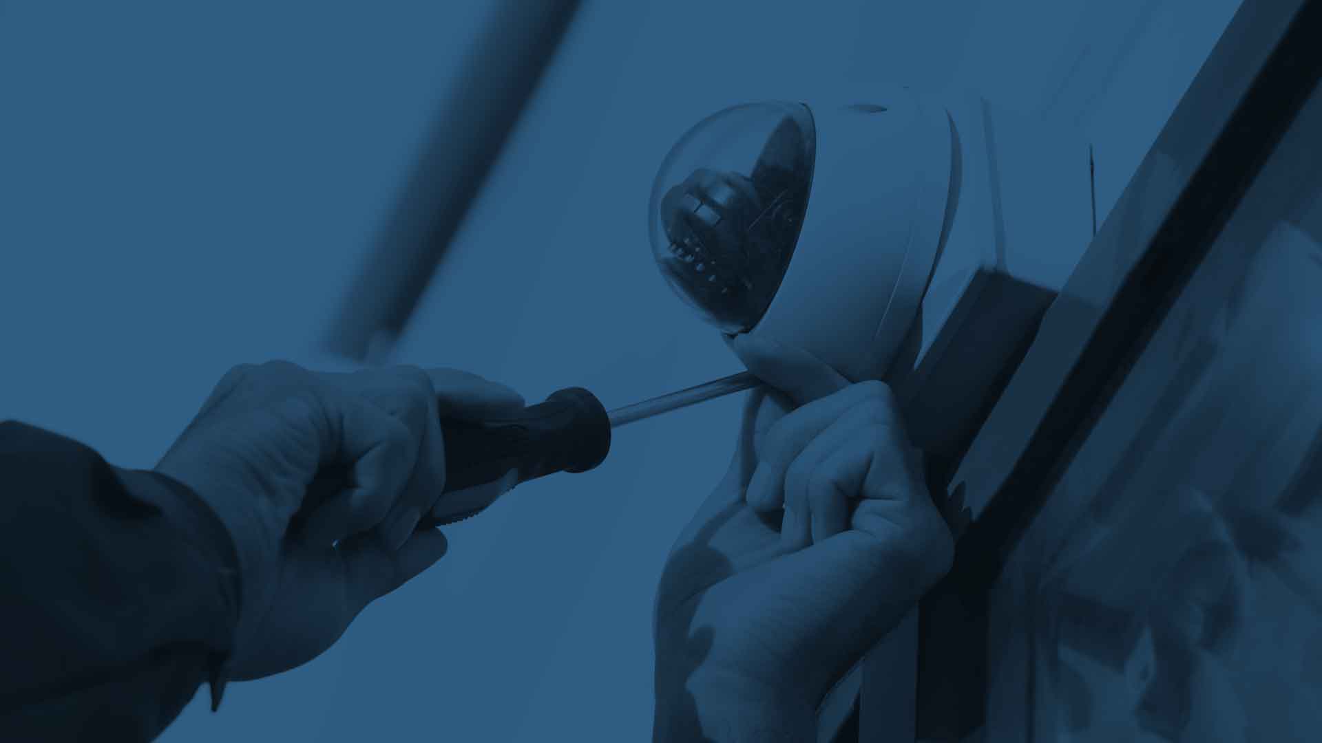 An expert technician completes a commercial security camera system installation for a local San Francisco enterprise