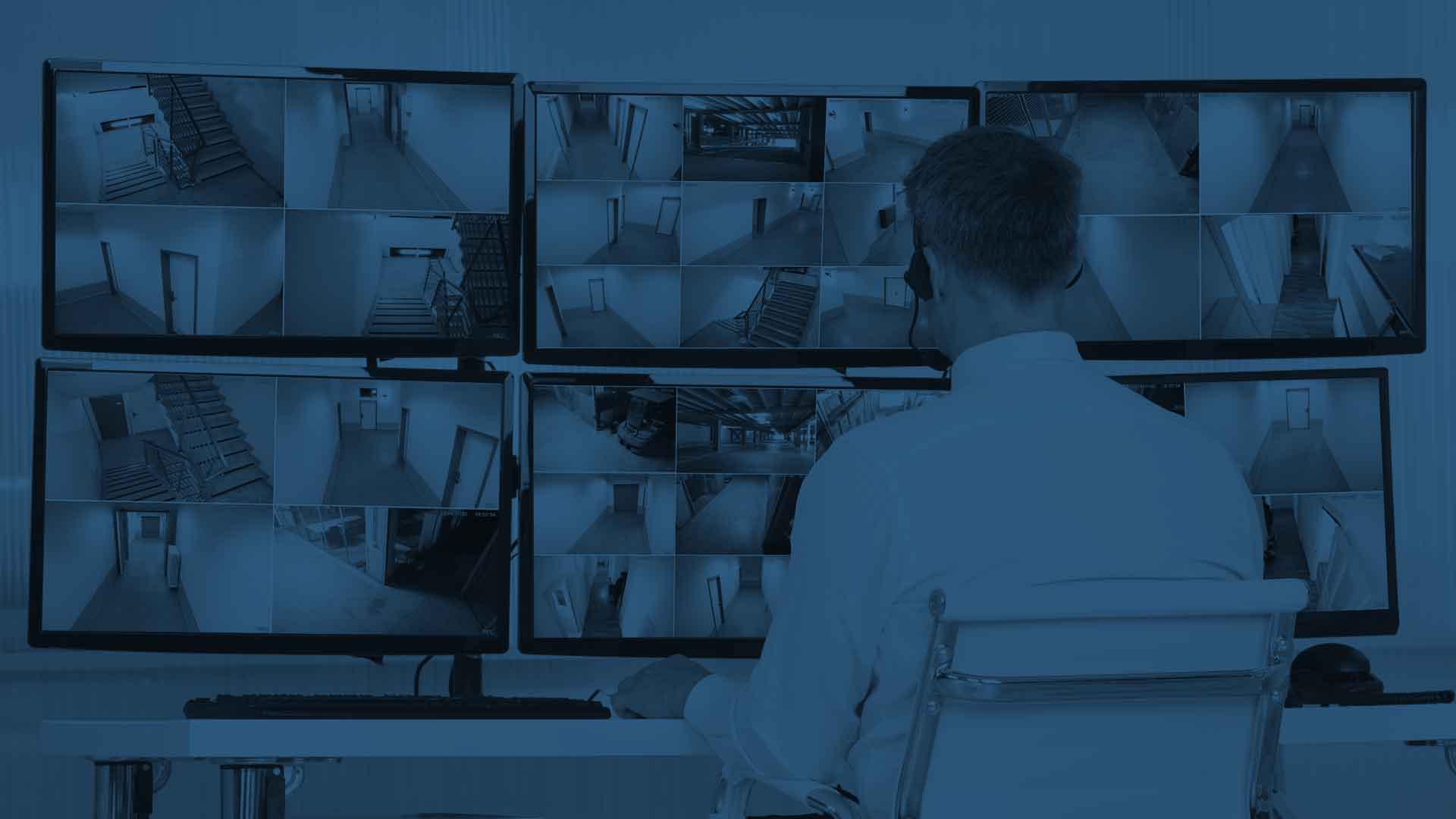 A security guard keeps an eye out for intruders using top-of-the-line security video system software